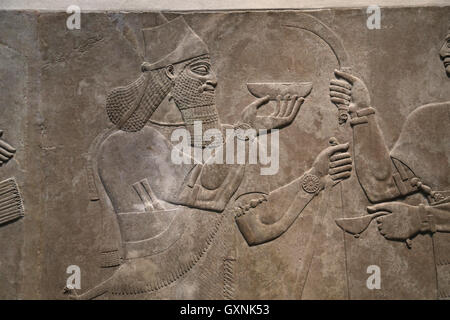 Relief King Ashurnasirpal II with ceremonial bowl. 883-859 B.C. Neo-Assyrian. Reign of Ashurnasirpal. Nimrud.  Mesopotamia. Stock Photo