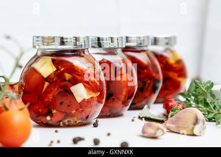 dried tomatoes in glass jar Stock Photo