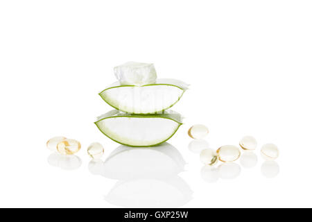 Aloe vera gel caps. Aloe vera, sliced leaf, and aloe vera gel caps isolated on white background. Stock Photo