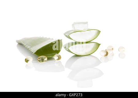 Aloe vera gel caps. Aloe vera, sliced leaf, and aloe vera gel caps isolated on white background. Stock Photo