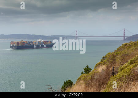 Mediterranean Shipping Company Container Ship, MSC Ariane, Approaches The San Francisco Golden Gate Bridge. Stock Photo