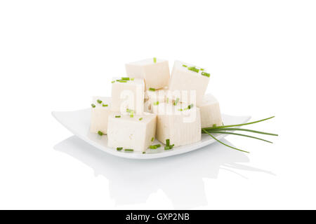 Culinary tofu eating. Tofu isolated on white background. Stock Photo