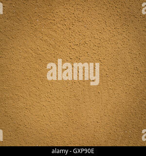 Mustard wall background and texture with vignetting and blank copyspace for text or advertising. Stock Photo