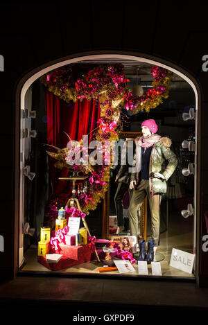 A lady's clothes shop window display as part of the Munich Christmas Market in Munich, Germany Stock Photo