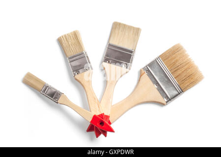 Several new wooden paint brushes in different sizes isolated on white with a clipping path. Stock Photo