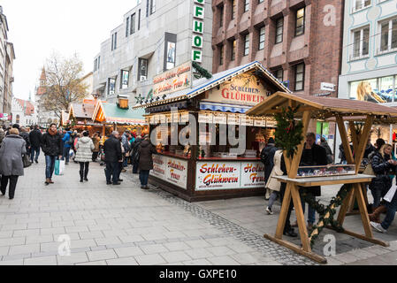 A row of wooden huts as part of the Munich Christmas Market in Kaufingerstrasse, Munich, Germany Stock Photo