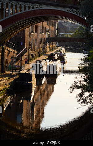 Manchester castleield canal boats      railway viaduct bridge city centre through  architecture golden sunshine sunny home  narr Stock Photo