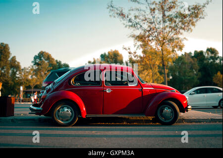 Izmir, Turkey - September 14, 2016: Red volkswagen beetle parked near the road. Stock Photo