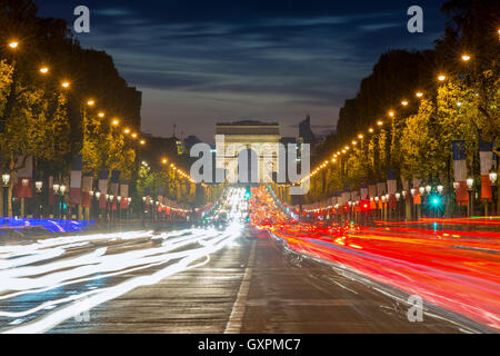 Arc de triumph Paris city at sunset, France. Champs Elysees street at night in Paris, France. Stock Photo