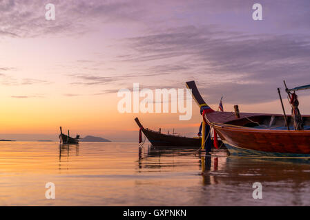 Beautiful sunrise in Rawai Phuket island Thailand with Long tailed boat Ruea Hang Yao Stock Photo