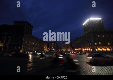 traffic by night in the famous Piazza Venezia, Rome, Italy Stock Photo