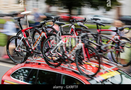 Tour of Britain support car carrying six bikes as it speeds through Clifton Bristol on the penultimate day of the race 2016 Stock Photo