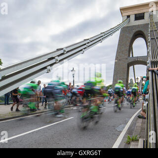 The peloton of the Tour of Britain cycle race passes over the Clifton Suspension Bridge in Bristol during the 2016 race Stock Photo