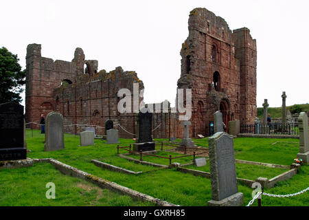 Lindisfarne Priory and churchyard, Holy Island, Northumberland coast, Northeast England, UK Stock Photo