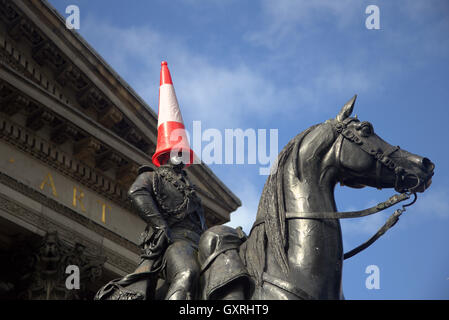 Glasgow Museum of Modern Art iconic cone head basks in the sun, Duke of wellington statue aptly adapted by local consent Stock Photo