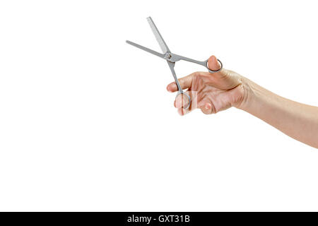 Woman hand is holding open thinning scissors for grooming pets isolated on the white background Stock Photo