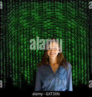 Nerd computer businesswoman on matrix binary background Stock Photo