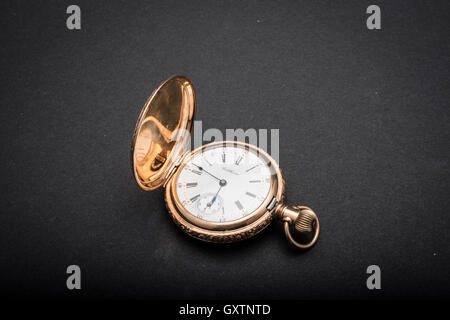 Gold vintage pocket watch on dark background Stock Photo