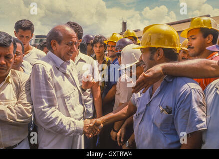 CIUDAD GUAYANA, VENEZUELA - Presidential candidate Carlos Andres Perez campaigning, shaking hands of workers at Ferrominera factory. October 1988 Stock Photo