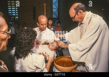 CIUDAD GUAYANA, VENEZUELA - Presidential candidate Carlos Andres Perez campaigning, baptism of child, Godfather, at El Robles Church. October 1988 Stock Photo