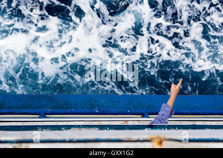 Pointing hand on flowing ship from Malta to Gozo Stock Photo