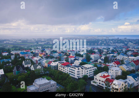 Beautiful super wide-angle aerial view of Reykjavik, Iceland with harbor and skyline mountains and scenery beyond the city, seen Stock Photo