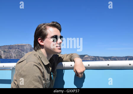 Portrait of young man on a volcano boat cruise, Crater Lake National Park, Oregon Stock Photo