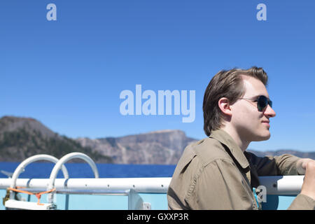 Portrait of young man on a volcano boat cruise, Crater Lake National Park, Oregon Stock Photo