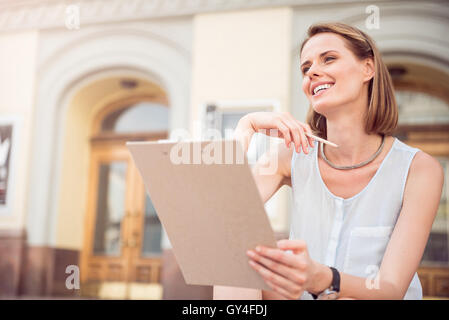 Attractive young woman drawing something Stock Photo