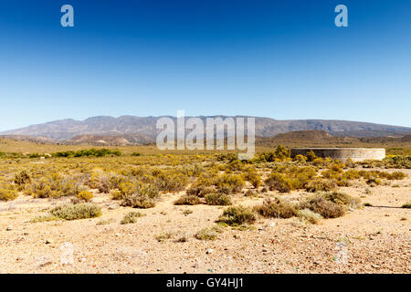 Landscape with a dam in the foreground. Stock Photo