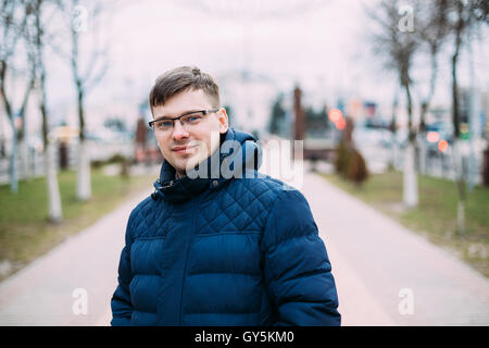 Young Handsome Man In Blue Jacket Outdoor In Spring Season Stock Photo