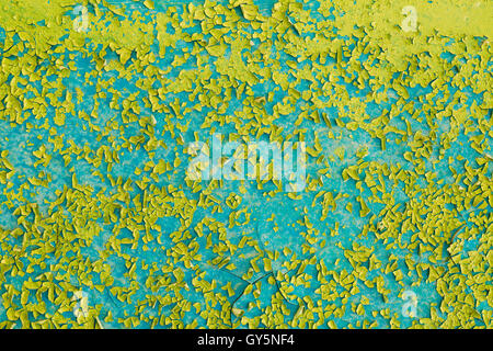 Close View Of Dyed Surface With Cracked And Peeling Texture Of Blue And Light Green Paint. Stock Photo