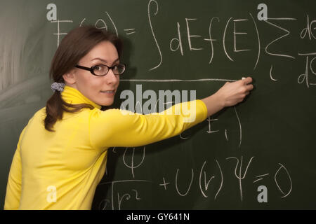 Portrait of an attractive beautiful pretty cute young brown haired caucasian woman (lady, girl, female, person, model) teacher Stock Photo