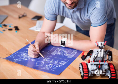 Pleasant senior engineer working on the project Stock Photo