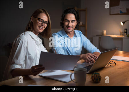 Happy colleagues working on project Stock Photo