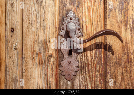 Door handle and old wooden door at the Holy Ghost Church in Kasern, Rear Ahrntal, South Tyrol, Italy Stock Photo