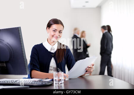Business woman holding important office documents Stock Photo
