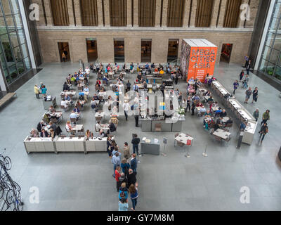Lunchtime diners line up at the New American Cafe at the Boston Museum of Fine Arts. Note art exhibit in right background. Stock Photo