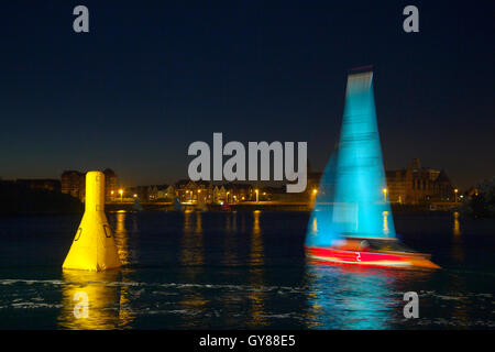 Merseyside, UK. 18th Sept, 2015. Dawn breaks over competitors in the Southport 24 Hour Race. A national sailing endurance race for two-handed sailing dinghies, with up to 70 Firefly, Lark, Enterprise and GP 14 boat crews competing. The exhausting race, which is hosted by the West Lancs Yacht Club starts at 12 noon on the Saturday with the contestants racing their dinghies non-stop, around the resorts marine lake finishing at noon 24 hours later.  Sailing skills and endurance are put to a severe test during the 12 hours of darkness. Credit:  MediaWorldImages/Alamy Live News Stock Photo