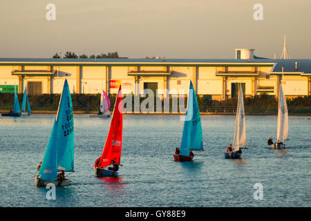 Merseyside, UK. 18th Sept, 2015. Dawn breaks over competitors in the Southport 24 Hour Race. A national sailing endurance race for two-handed sailing dinghies, with up to 70 Firefly, Lark, Enterprise and GP 14 boat crews competing. The exhausting race, which is hosted by the West Lancs Yacht Club starts at 12 noon on the Saturday with the contestants racing their dinghies non-stop, around the resorts marine lake finishing at noon 24 hours later.  Sailing skills and endurance are put to a severe test during the 12 hours of darkness. Credit:  MediaWorldImages/Alamy Live News Stock Photo