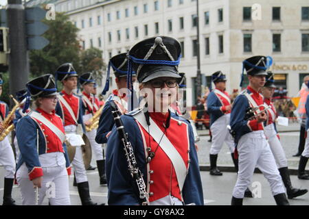 Munich, Germany. 18th Sep, 2016. People in traditional costumes attend a costume parade during the Oktoberfest in Munich, southern Germany, on Sept. 18, 2016. The 183rd Munich Oktoberfest lasts from Sept. 17 to Oct. 3. Credit:  Zhu Sheng/Xinhua/Alamy Live News Stock Photo