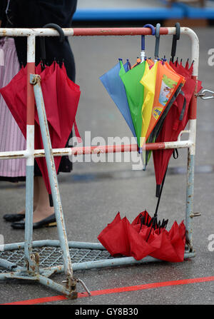 Munich, Germany. 18th Sep, 2016. Umbrellas hanging on a fence at Oktoberfest in Munich, Germany, 18 September 2016. Millions of visitors from all over the world are again expected at the 183rd Oktoberfest, which runs until 03 October 2016. Stock Photo