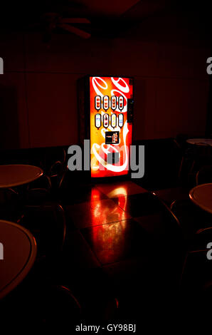 A machine for purchasing Coca Cola soda sits on a covered patio on a college campus, Tucson, Arizona, USA. Stock Photo