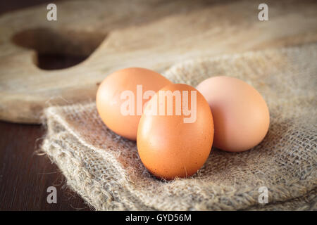 Three fresh uncooked chicken eggs for an healthy meal Stock Photo