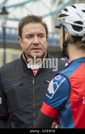 Ambassador for the Blue Marine Foundation Simon Le Bon talks to a cyclist, at the start of the Blue Marine Foundation London to Monaco Bike Challenge, at The Tower of London, where over 50 cyclists begin the 1500 km in aid of ocean conservation. Stock Photo