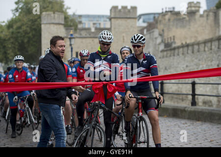 Ambassador for the Blue Marine Foundation Simon Le Bon (left) cuts a ribbon at the start of the Blue Marine Foundation London to Monaco Bike Challenge, at The Tower of London, where over 50 cyclists begin the 1500 km in aid of ocean conservation. Stock Photo