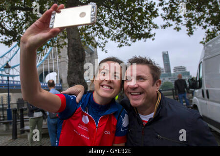 Cyclist Sara-Jane Skinner takes a selfie with ambassador for the Blue Marine Foundation Simon Le Bon, at the start of the Blue Marine Foundation London to Monaco Bike Challenge, at The Tower of London, where over 50 cyclists begin the 1500 km in aid of ocean conservation. Stock Photo