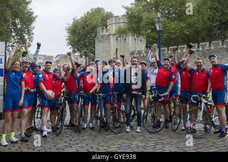 Ambassador for the Blue Marine Foundation Simon Le Bon (centre in black) poses with cyclists at the start of the Blue Marine Foundation London to Monaco Bike Challenge, at The Tower of London, where over 50 cyclists begin the 1500 km in aid of ocean conservation. Stock Photo
