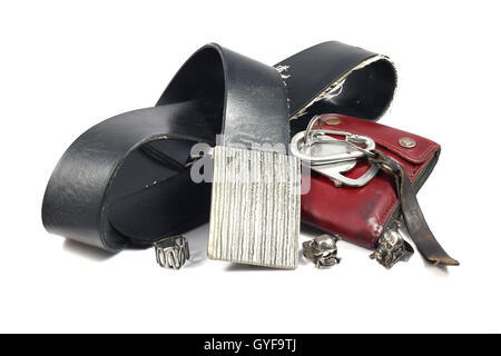 black leather belt, vintage buckle, skull silver ring and red wallet on white background Stock Photo