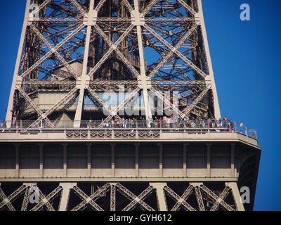 Close up view of the 2nd Floor of Eiffel Tower with Tourists, Paris, France on a clear blue sky day Stock Photo